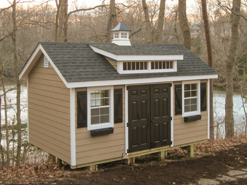 tan classic studio dormer shed with double black doors