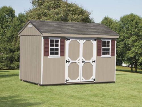 brown cottage shed sitting in backyard
