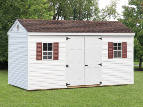 white cottage shed with white doors