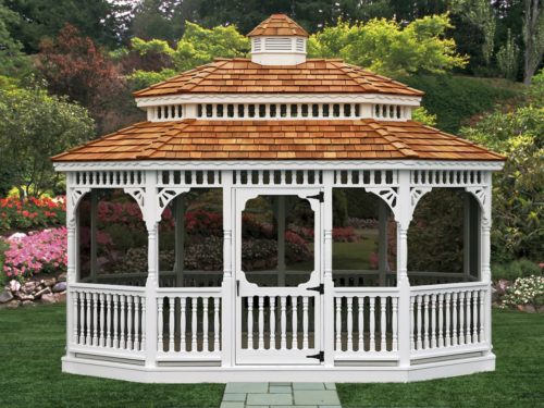 large vinyl gazebo sitting in front of flowers