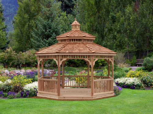backyard wood gazebo in front of flower garden