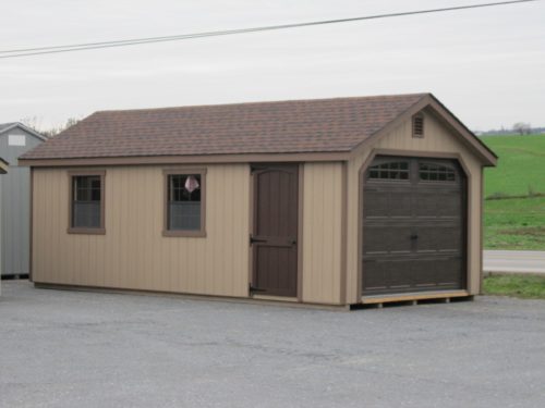tan amish built classic cottage garage with brown doors