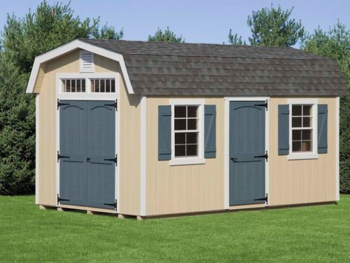 classic dutch barn with blue doors and asphalt shingle roof
