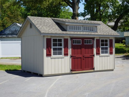 classic studio dormer shed with red doors