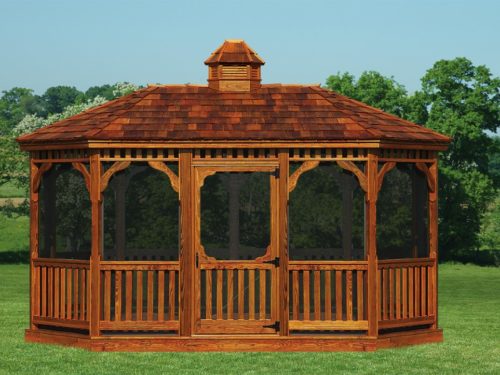 large amish built wood gazebo on grass in front of trees