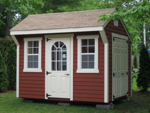maroon quaker shed with white door