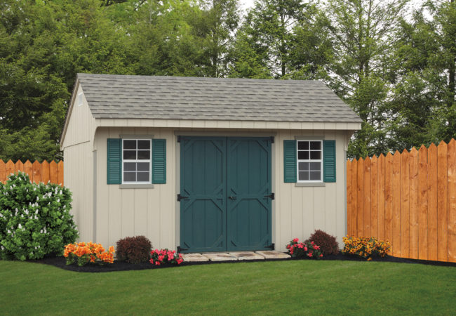 backyard quaker shed sitting in front of wood fence