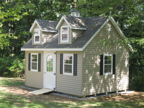 custom classic cottage shed with white front door