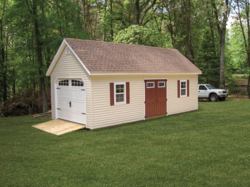 custom classic cottage shed in front of white truck and trees