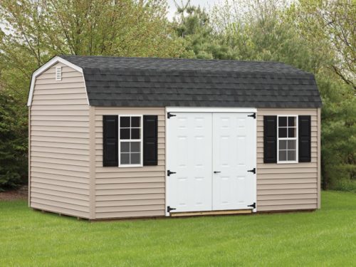 tan dutch barn shed with white double door