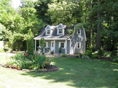 amish built blue two story dutch barn in backyard