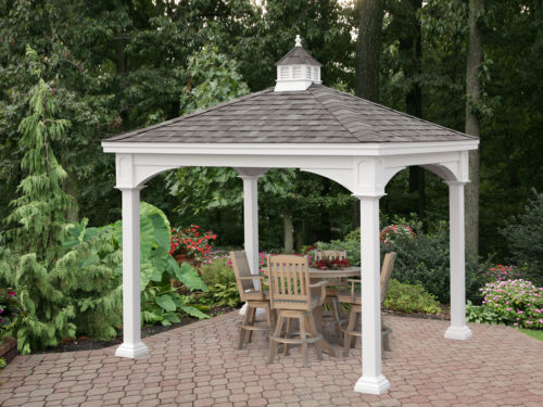 backyard vinyl pavilion sitting in front of flowers and trees