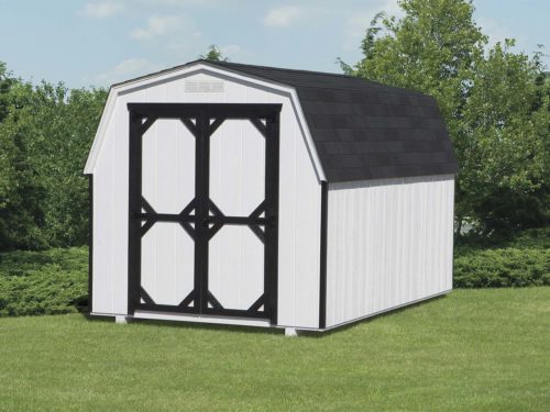 amish built white mini barn shed sitting on grass