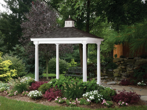 vinyl pavilion sitting next to flower bed