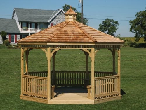 amish built wood gazebo sitting on lawn in front of house