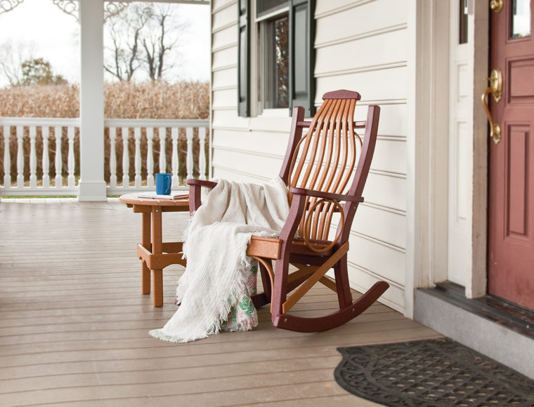 brown and maroon rocking chair and coffee table with white blanket