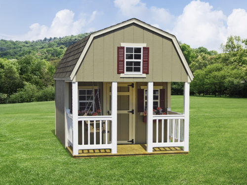 dutch playhouse in backyard in front of trees