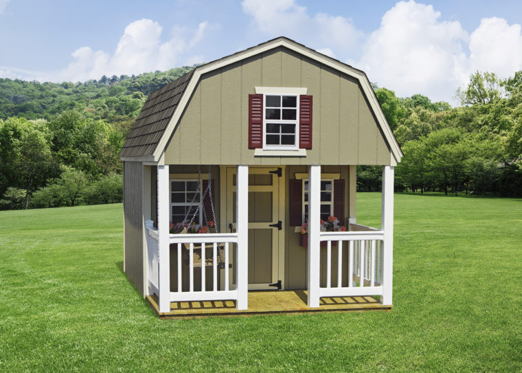 dutch playhouse in backyard in front of trees