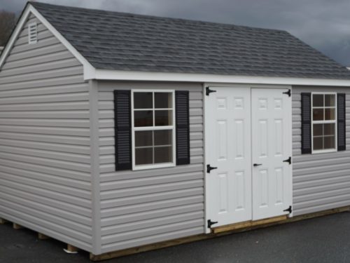 grey cape shed with white doors