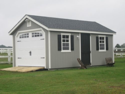 grey classic cottage garage with white door
