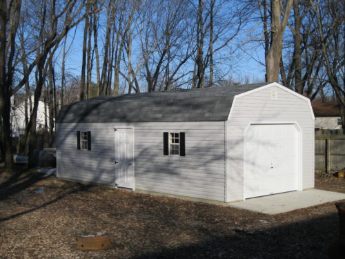 light grey storage garage with white garage door