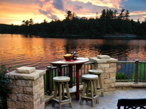outdoor lawn furniture sitting next to lake in rural maryland