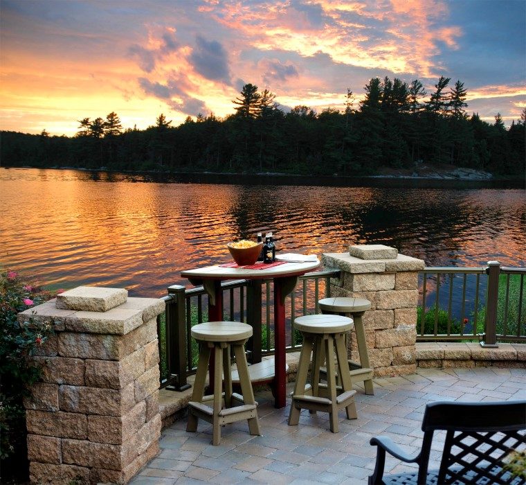 outdoor lawn furniture sitting next to lake in rural maryland