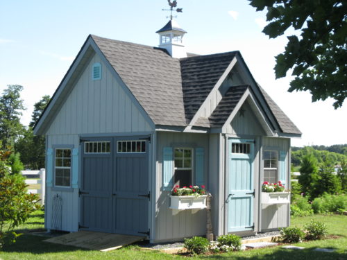 alpine shed with blue doors in backyard