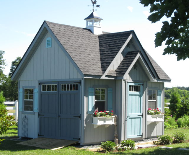 alpine shed with blue doors in backyard