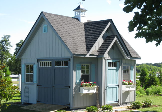 alpine shed with blue doors in backyard