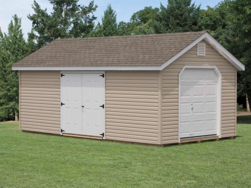 tan classic cottage garage with white doors