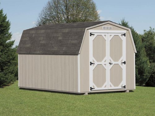 tan amish built mini barn shed sitting on lawn