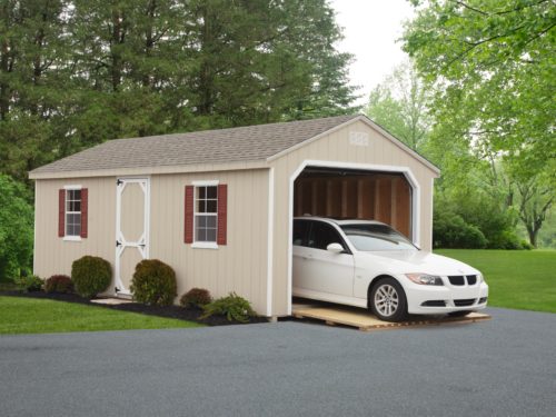 tan 7 cottage garage with white car inside