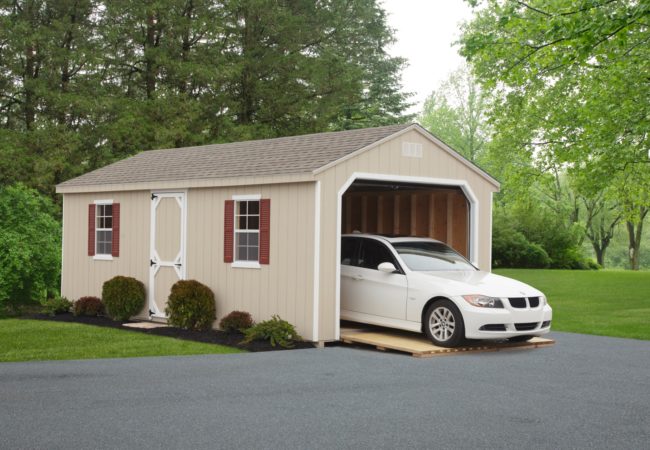 tan 7 cottage garage with white car inside