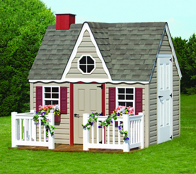 victorian playhouse sitting in backyard