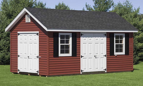 maroon man cave shed with white doors and shingle roof